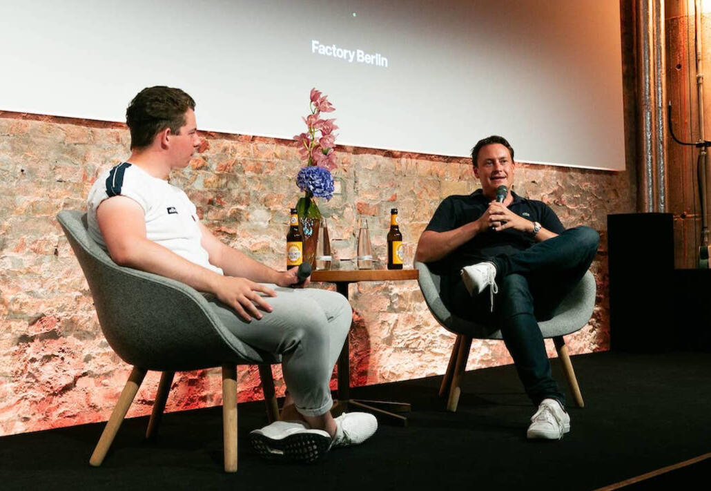 Fabian Tausch hosting a fireside chat with Finn Hänsel, founder of Sanity Group, at Factory Berlin.